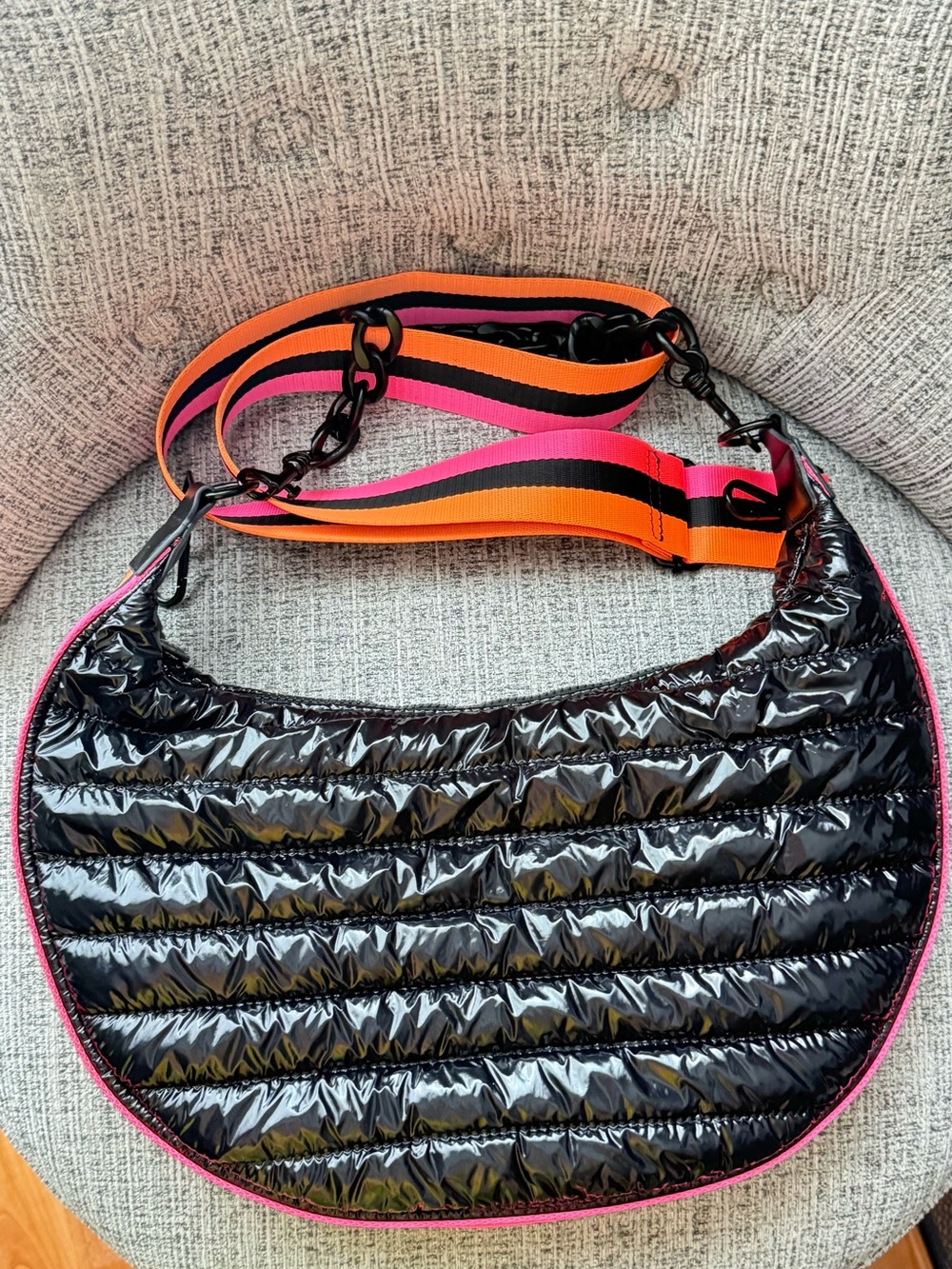 BCBGeneration Quilted Crescent Shoulder Bag in Black with Pink & Orange Strap